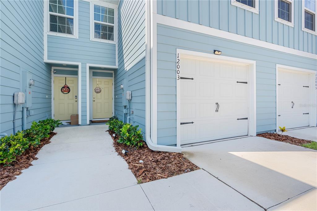 12003 Grizzly Lane New Port Richey, FL 34654 - Photo 2 of 43 a view of a entryway door front of house