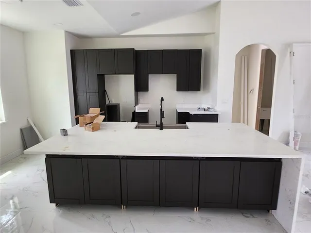 a front view of house with yard and trees