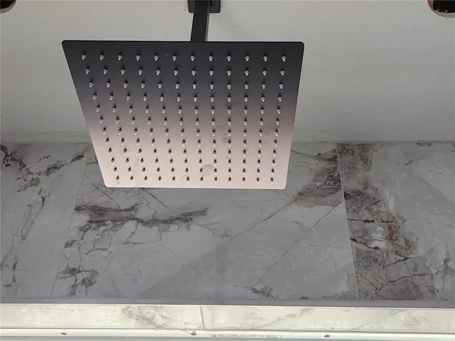 an empty room with a empty space and a ceiling fan