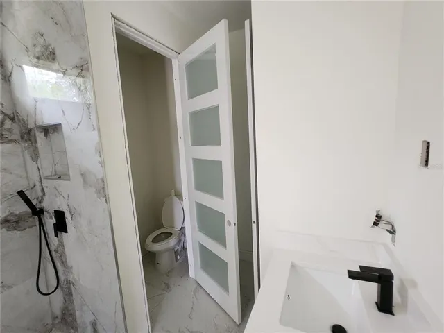 a view of a big room with closet and cabinet