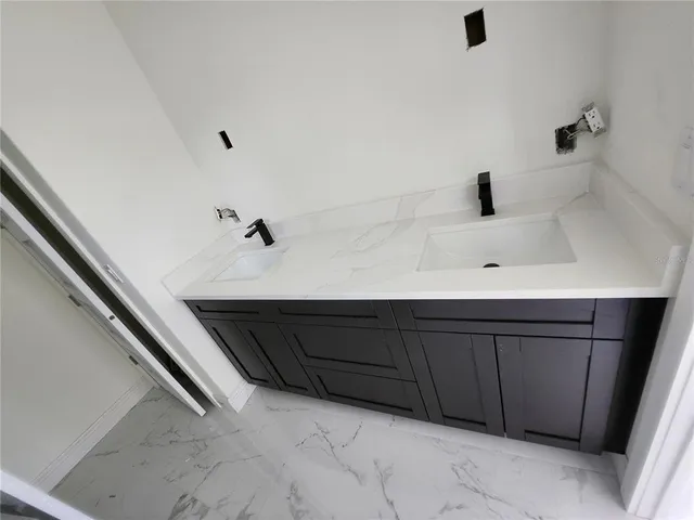 a room with a dresser and a window