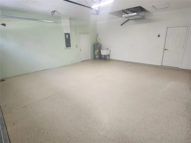 a bathroom with a double vanity sink a mirror and shower