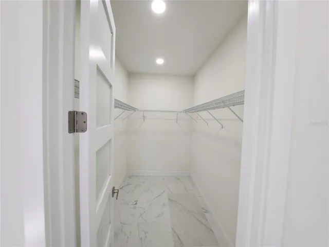 a house that has a tree in front of the house