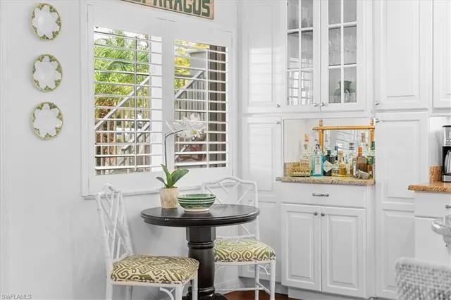 a view of a dining room with furniture and windows
