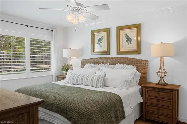 a bedroom with a bed and a night stand