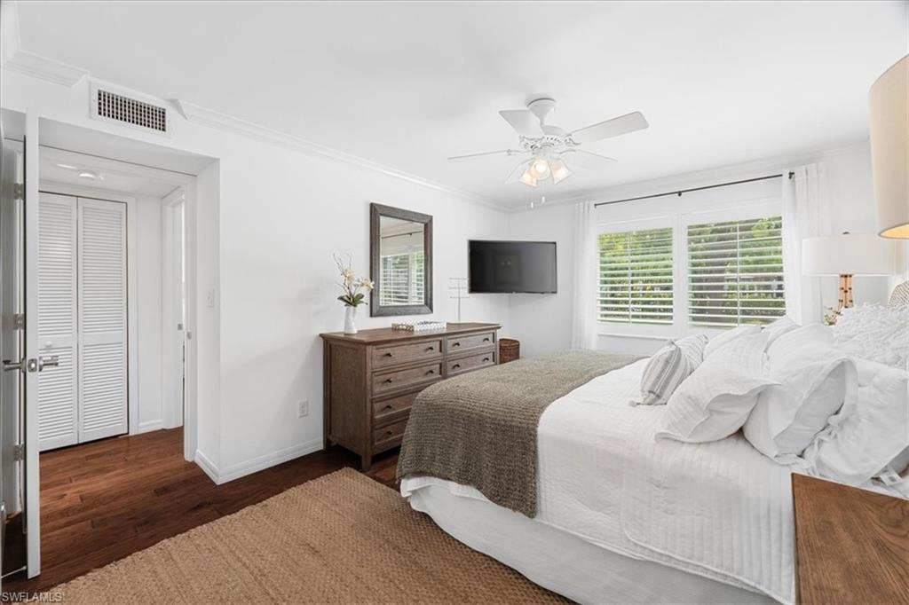 380 4th Avenue South, Unit 380 Naples, FL 34102 - Photo 7 of 19 a bedroom with a large bed and a window