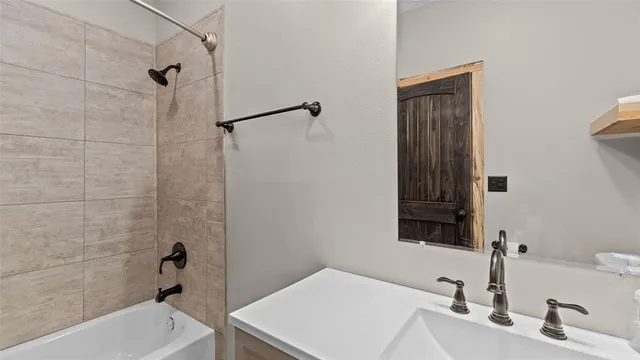 a bathroom with a sink and a bathtub