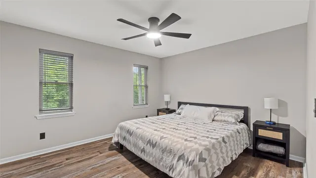 a bedroom with a large bed and a window