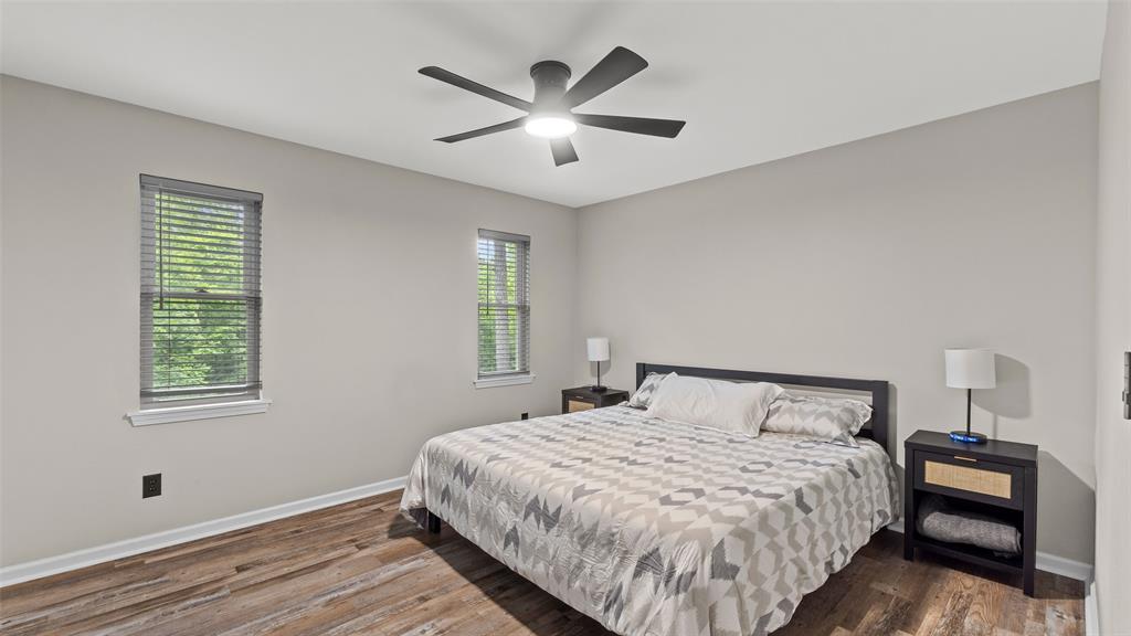 228 Old Factory Road Murfreesboro, AR 71958 - Photo 20 of 37 a bedroom with a large bed and a window