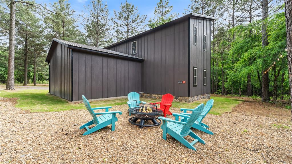 228 Old Factory Road Murfreesboro, AR 71958 - Photo 2 of 37 a backyard of a house with table and chairs