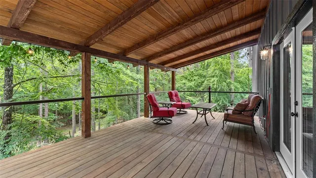 a sitting area with couch on wooden floor