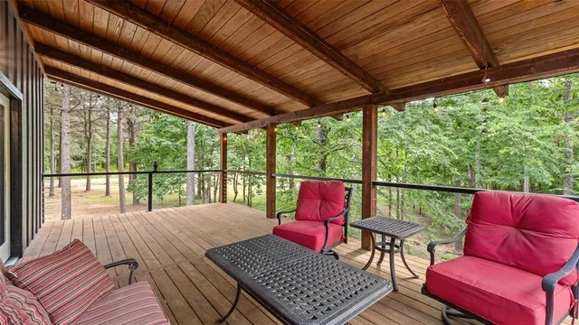 a balcony with furniture and wooden floor