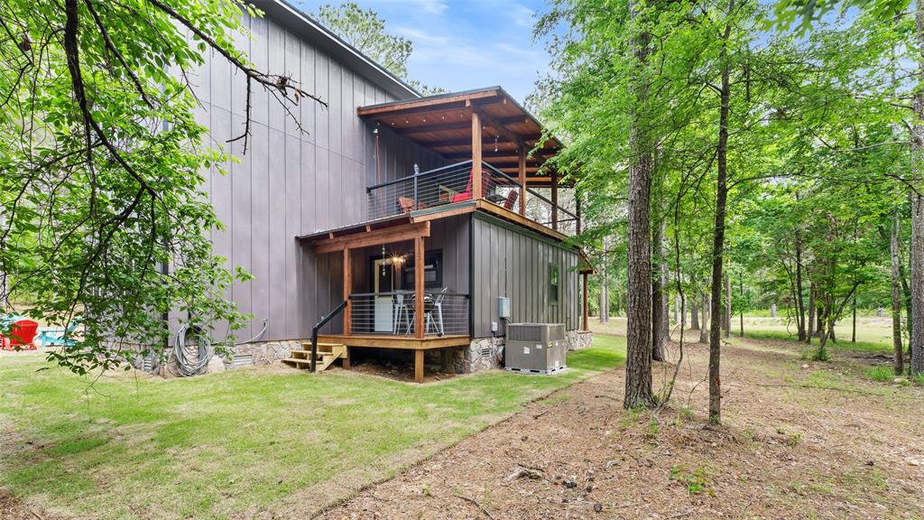 228 Old Factory Road Murfreesboro, AR 71958 - Photo 26 of 37 a backyard of a house with table and chairs