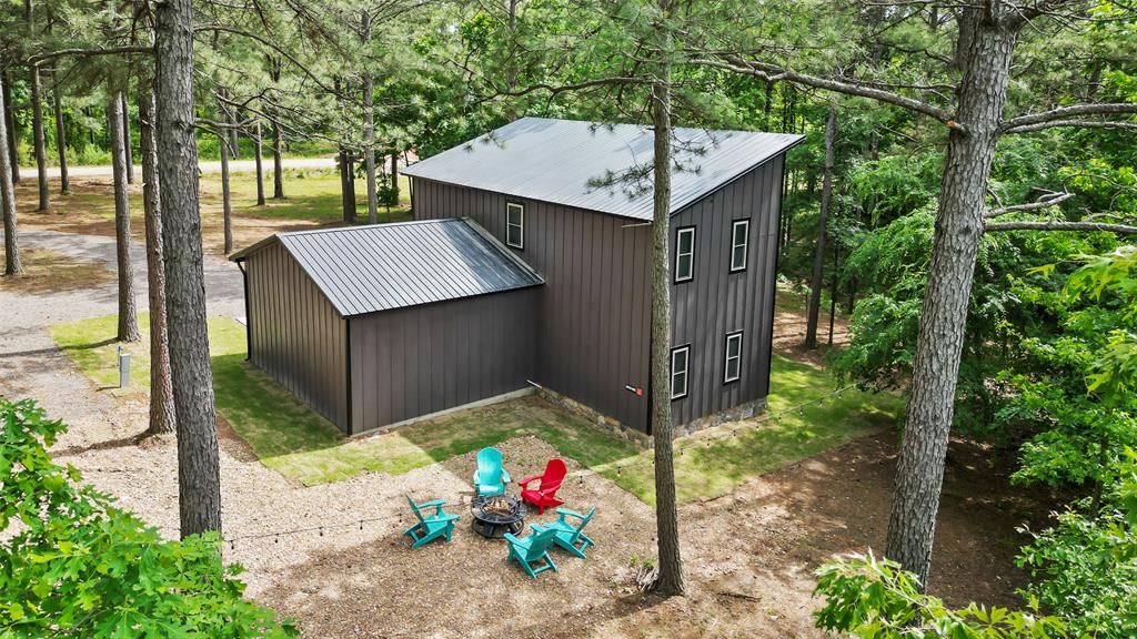 228 Old Factory Road Murfreesboro, AR 71958 - Photo 3 of 37 a table and chairs sitting in a garden