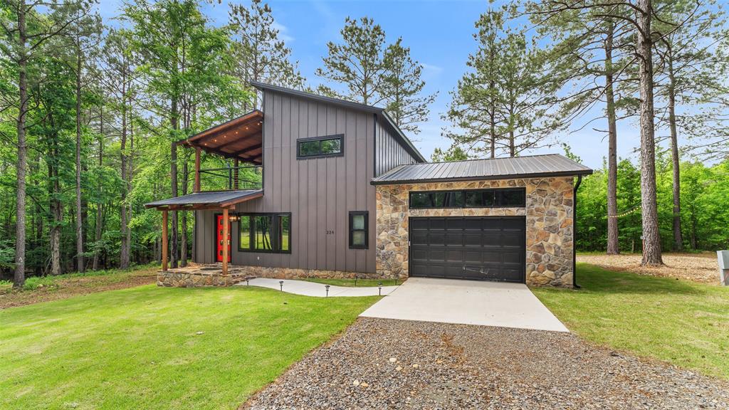 228 Old Factory Road Murfreesboro, AR 71958 - Photo 31 of 37 front view of a house with a yard
