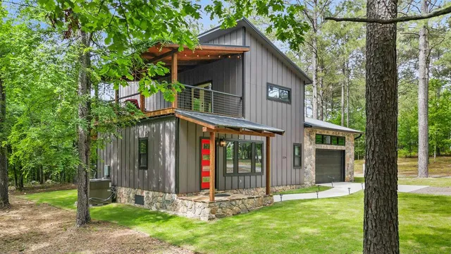 a front view of a house with a yard table and chairs