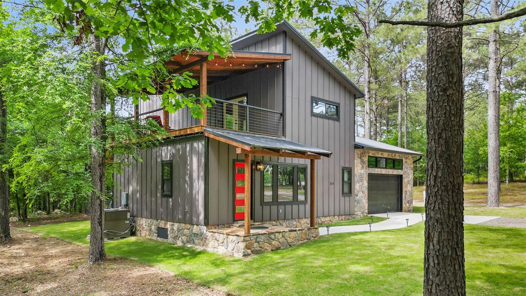 228 Old Factory Road Murfreesboro, AR 71958 - Photo 32 of 37 a front view of a house with a yard table and chairs