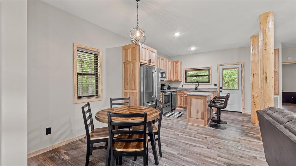 228 Old Factory Road Murfreesboro, AR 71958 - Photo 10 of 37 a view of a dining room with furniture and wooden floor