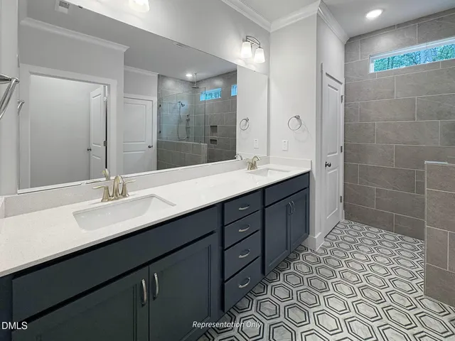 a kitchen with stainless steel appliances kitchen island granite countertop a refrigerator a stove a sink a dining table and chairs with wooden floor