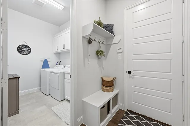 a living room with furniture ceiling fan and a large window