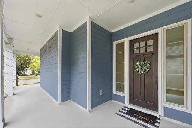 an aerial view of a house with a lake view