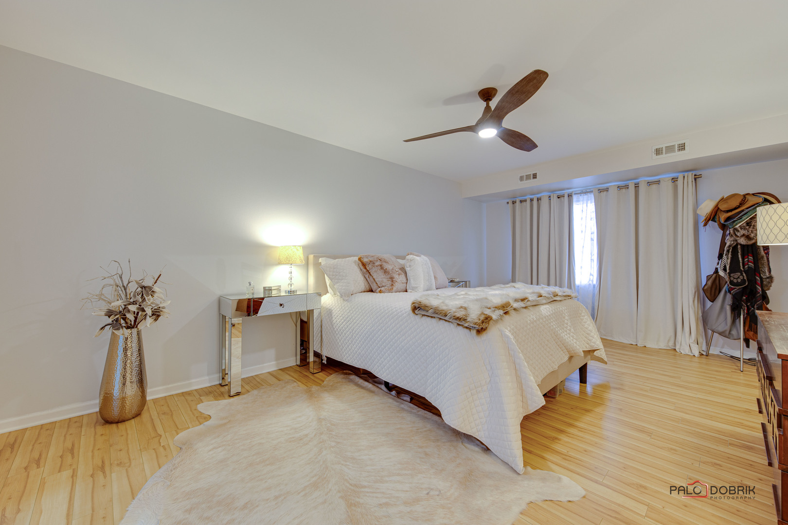 2420 West Talcott Road, Unit 315 Park Ridge, IL 60068 - Photo 14 of 22 a bed room with a bed and a chandelier