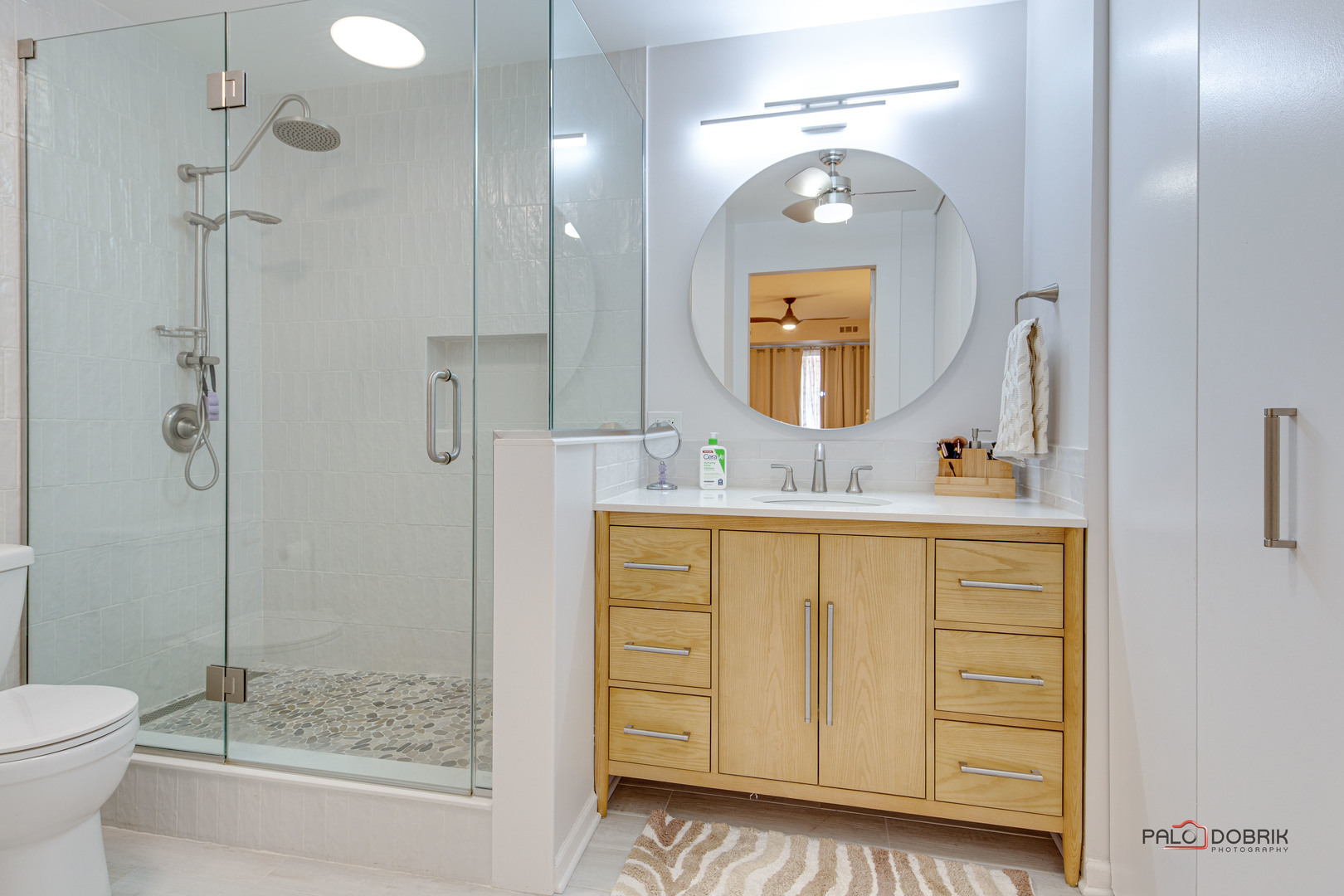 2420 West Talcott Road, Unit 315 Park Ridge, IL 60068 - Photo 16 of 22 a bathroom with a sink a toilet and large mirror