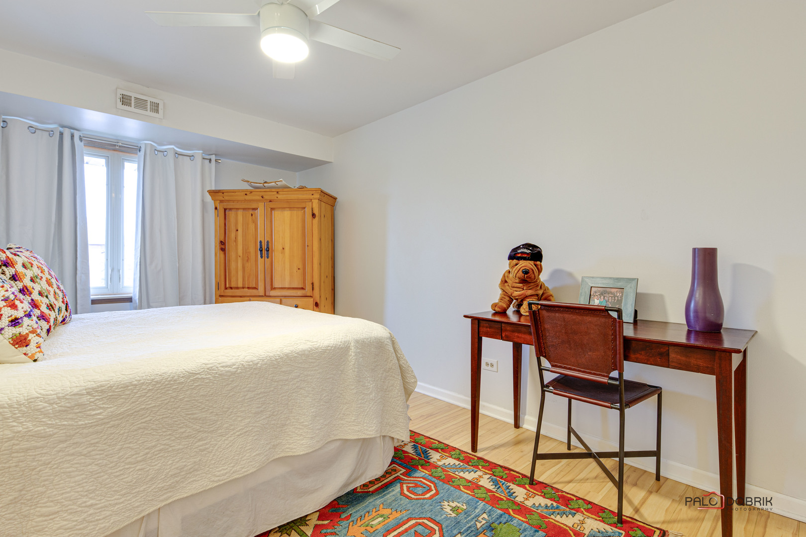 2420 West Talcott Road, Unit 315 Park Ridge, IL 60068 - Photo 17 of 22 a bedroom with a bed and wooden floor