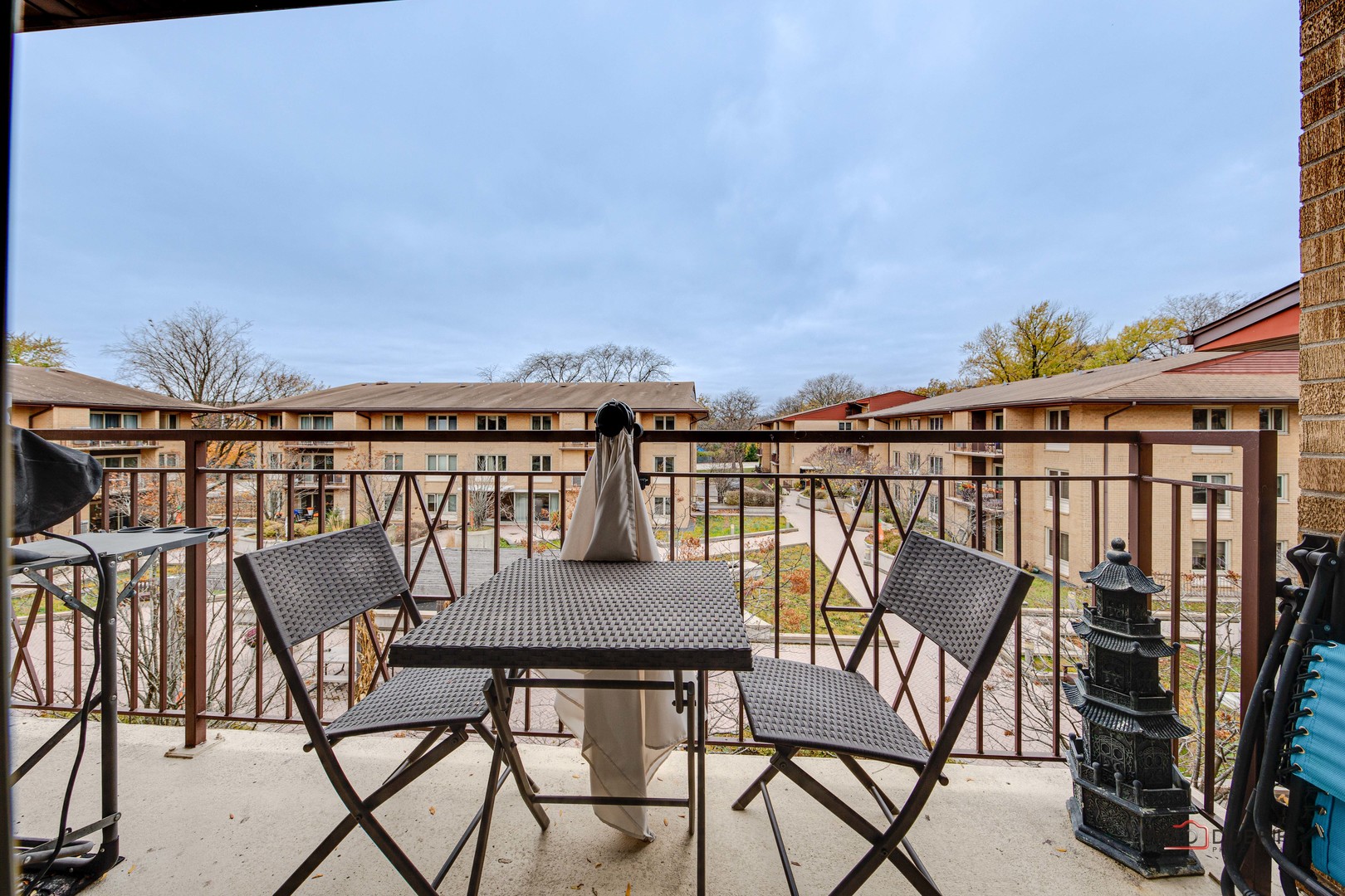 2420 West Talcott Road, Unit 315 Park Ridge, IL 60068 - Photo 20 of 22 a view of a chairs and table on the terrace