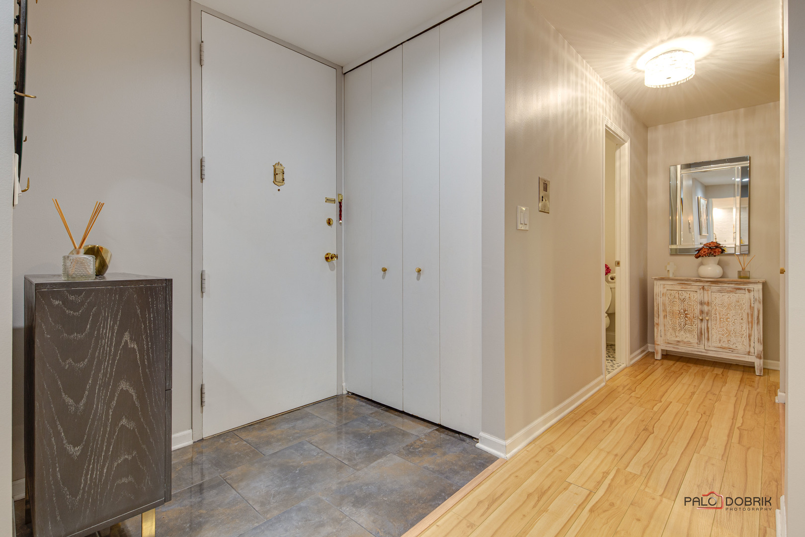 2420 West Talcott Road, Unit 315 Park Ridge, IL 60068 - Photo 5 of 22 a view of a hallway with wooden floor and a bathroom