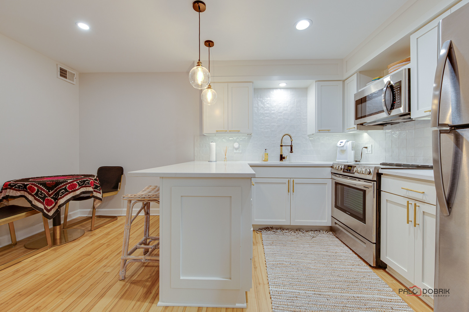 2420 West Talcott Road, Unit 315 Park Ridge, IL 60068 - Photo 8 of 22 a kitchen with stainless steel appliances kitchen island granite countertop a sink and a refrigerator