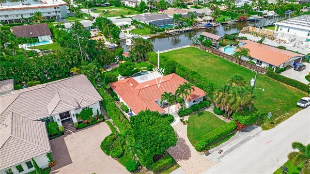 an aerial view of multiple houses with yard