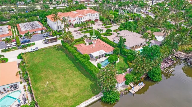 an aerial view of residential houses with outdoor space and street view