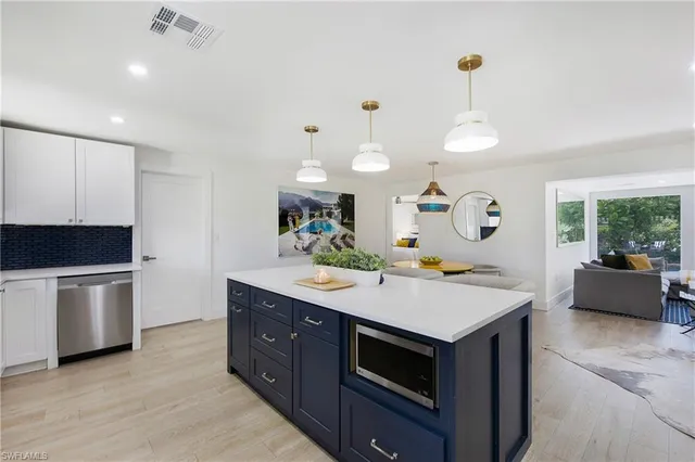 a kitchen with a stove and a sink