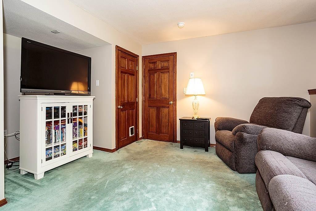 4 Chippewa Road Westford, MA 01886 - Photo 18 of 25 a livingroom with furniture and a flat screen tv