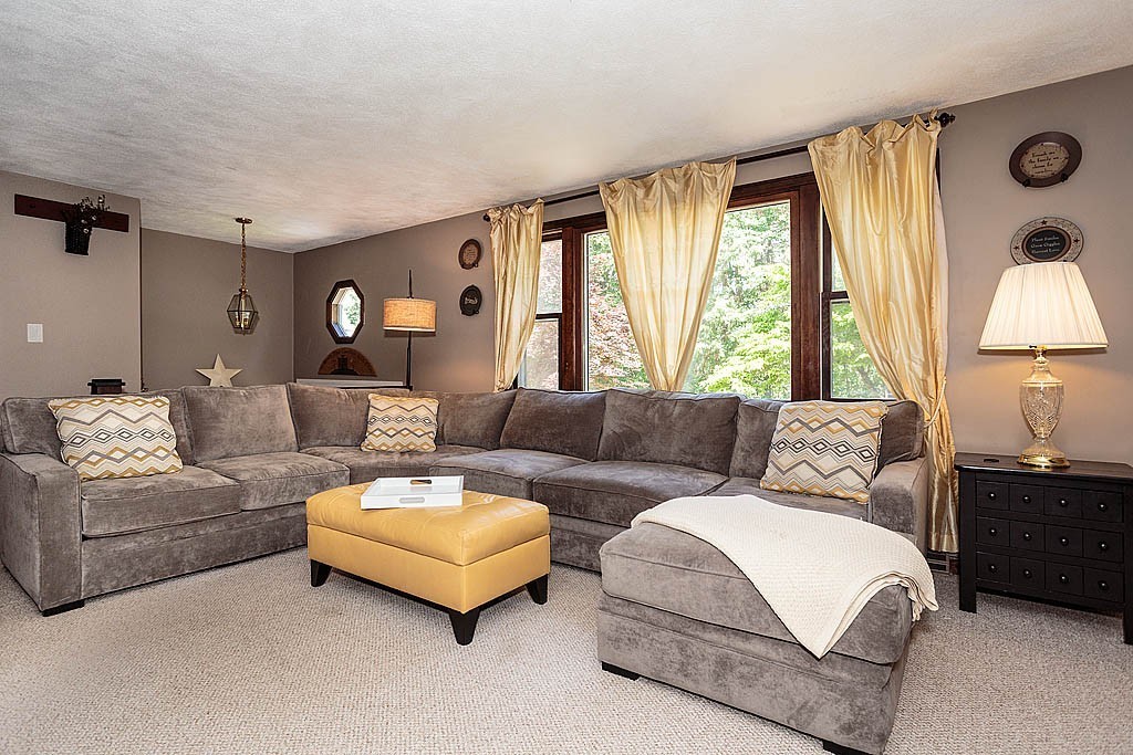 4 Chippewa Road Westford, MA 01886 - Photo 2 of 25 a living room with furniture and a large window