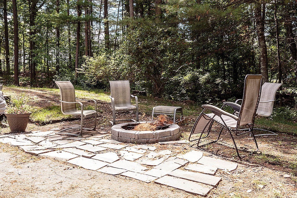 4 Chippewa Road Westford, MA 01886 - Photo 5 of 25 a chairs and a table in a backyard