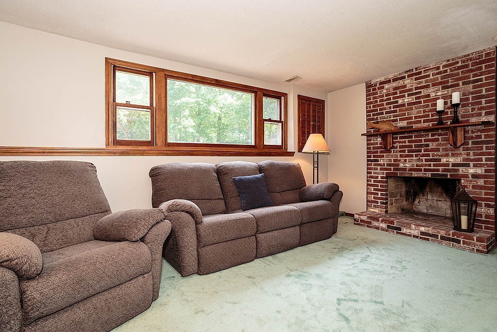 4 Chippewa Road Westford, MA 01886 - Photo 6 of 25 a living room with furniture a window and a fireplace