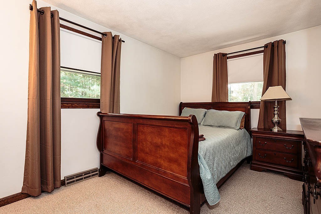 4 Chippewa Road Westford, MA 01886 - Photo 9 of 25 a bedroom with a bed and a window