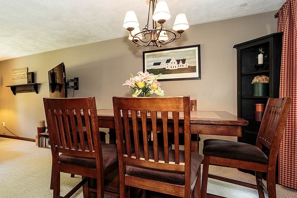 4 Chippewa Road Westford, MA 01886 - Photo 10 of 25 a view of a dining room with furniture and chandelier