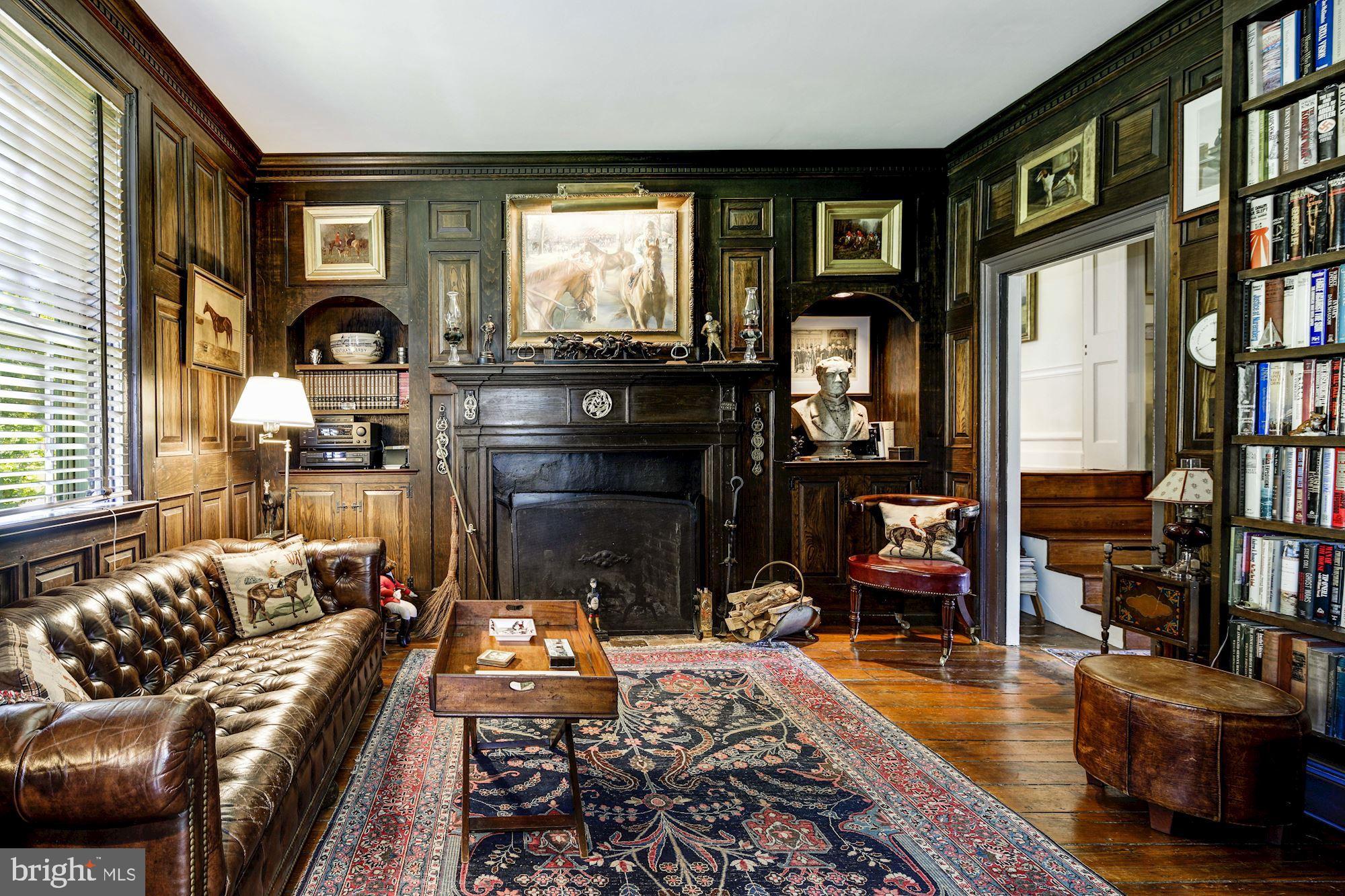 13032 Highland Road Highland, MD 20777 - Photo 25 of 114 a living room with furniture fireplace and flat screen tv
