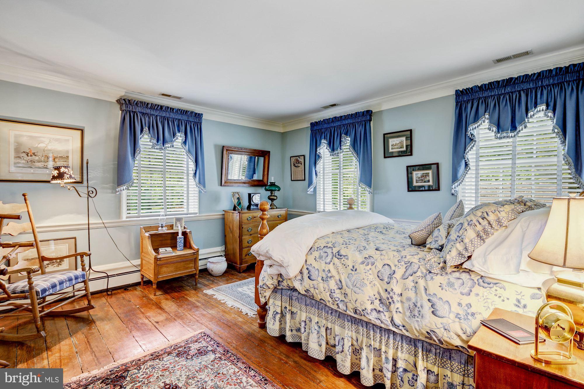 13032 Highland Road Highland, MD 20777 - Photo 37 of 114 a bedroom with a bed couch and a window