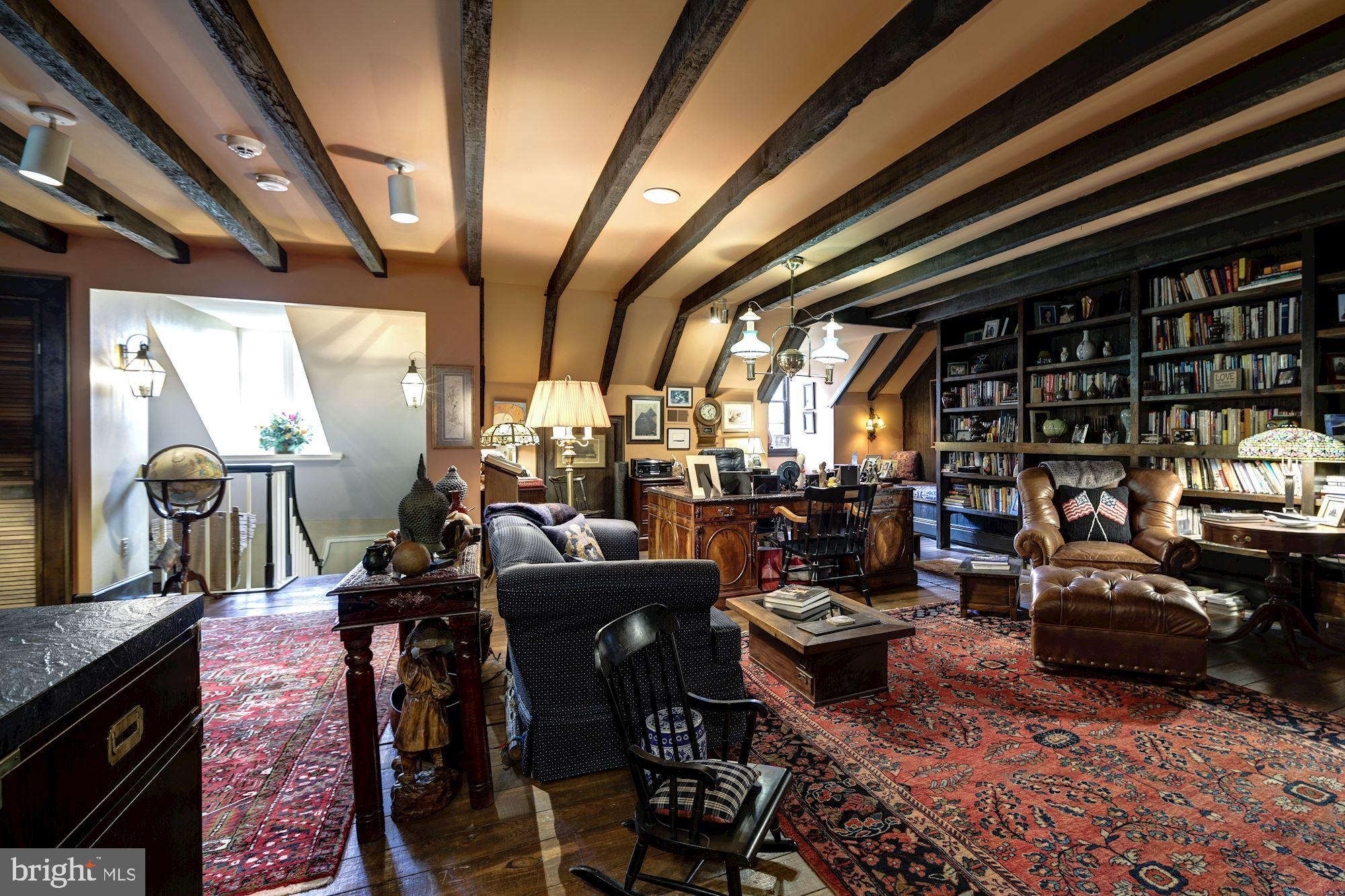 13032 Highland Road Highland, MD 20777 - Photo 42 of 114 a living room with lots of furniture and a fireplace