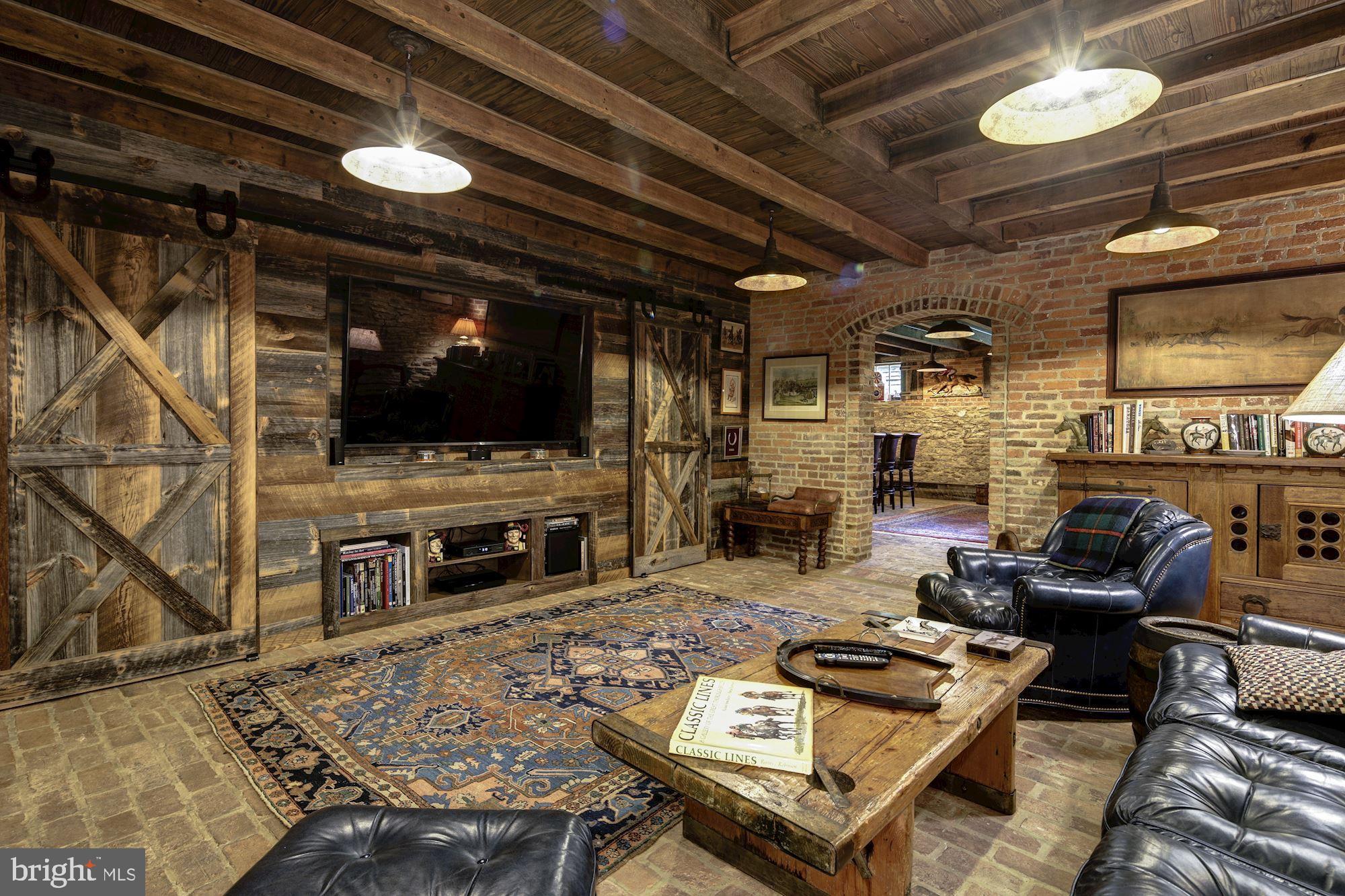 13032 Highland Road Highland, MD 20777 - Photo 55 of 114 a living room with furniture a flat screen tv and a fireplace