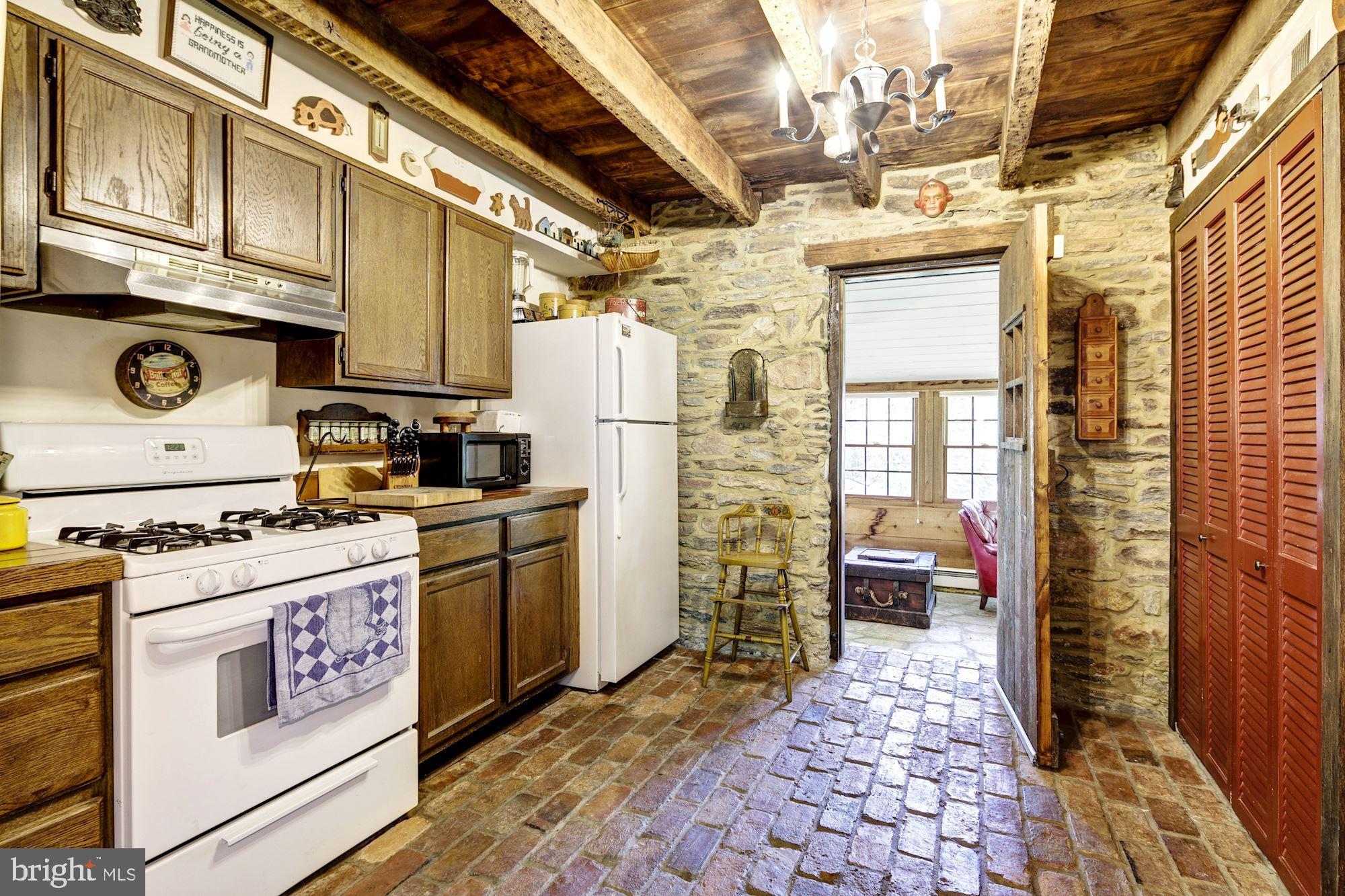 13032 Highland Road Highland, MD 20777 - Photo 83 of 114 a kitchen with stainless steel appliances granite countertop a stove a refrigerator and cabinets