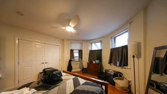 a view of walk in closet with clothes