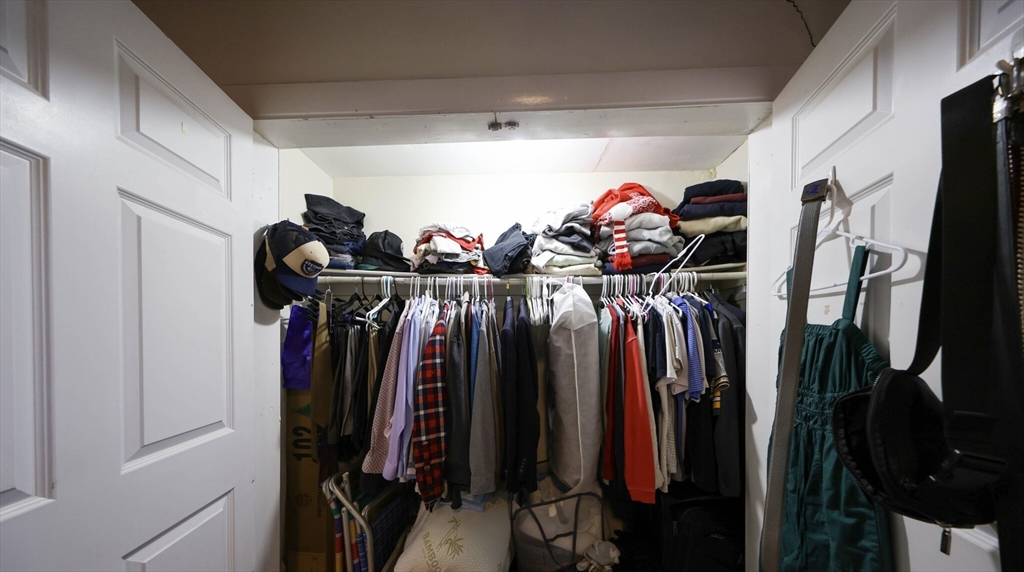 1728 Beacon Street, Unit B Brookline, MA 02445 - Photo 9 of 10 a view of walk in closet with clothes