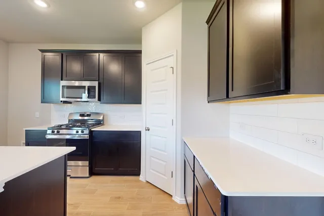 a kitchen with a sink and a refrigerator