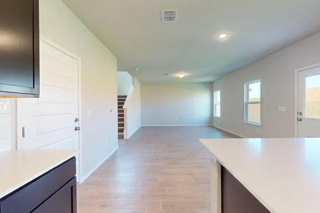 a view of a kitchen cabinets and entryway
