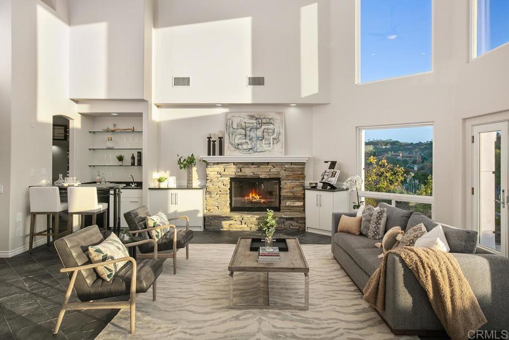 3325 Jasmine Crest Encinitas, CA 92024 - Photo 12 of 45 a living room with furniture a fireplace and a table